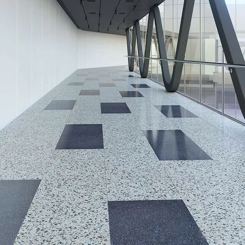 Hành lang công trình lát gạch Terrazzo nền sáng xen ô màu tối